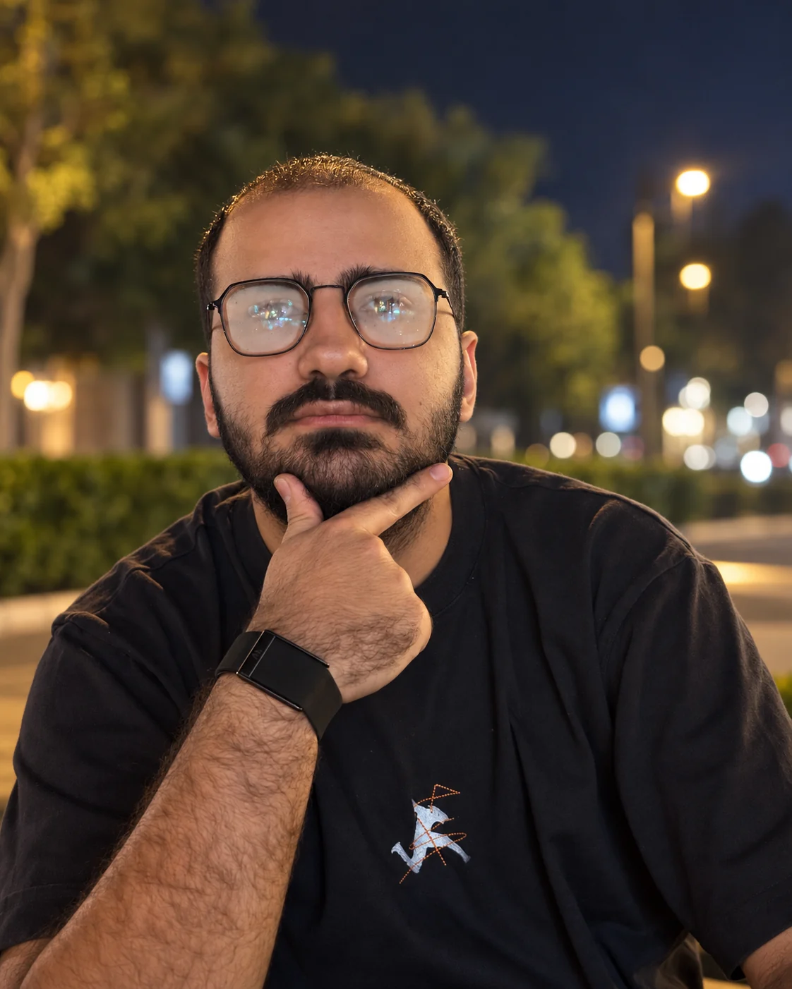 Amirali Sheidaei in a candid nighttime portrait
